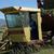 Bob in the harrowbed picking up the hay bales.